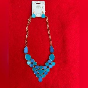 Blue necklace with gold accent statement and earrings